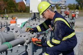 worker detecting on pipes